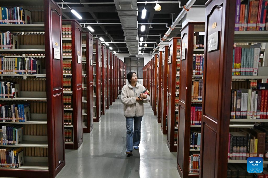 A student walks at a library on Laoshan campus of Ocean University of China in Qingdao, east China's Shandong Province, Oct. 21, 2024. The 100th anniversary of the founding of Ocean University of China will fall on Oct. 25, 2024. (Photo: Xinhua)