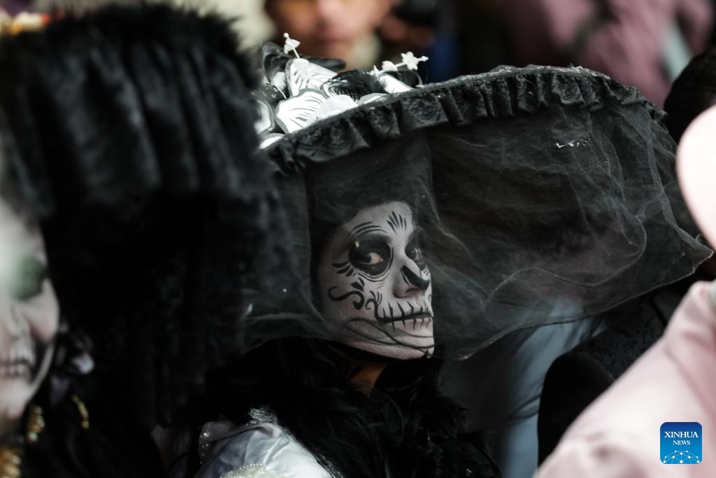 A citizen with facial makeup participates in the media presentation of the Day of the Dead activities in Mexico City, Mexico, on Oct. 21, 2024. Day of the Dead is a Mexican holiday involving family and friends gathering to pray for and remember friends and family members who have died. (Photo: Xinhua)