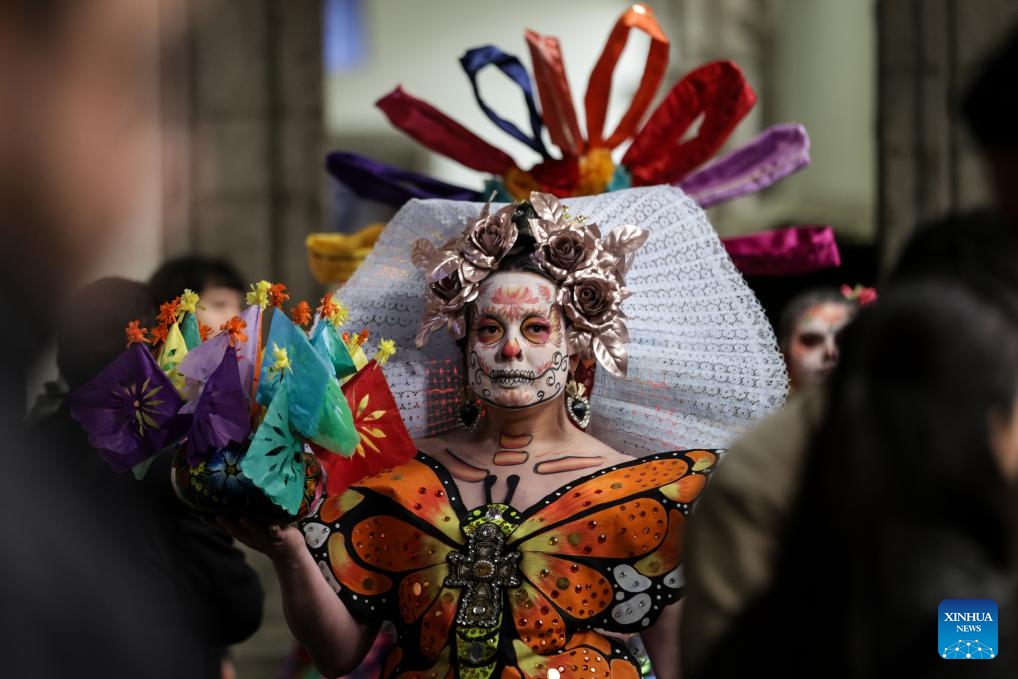 A citizen with facial makeup participates in the media presentation of the Day of the Dead activities in Mexico City, Mexico, on Oct. 21, 2024. Day of the Dead is a Mexican holiday involving family and friends gathering to pray for and remember friends and family members who have died. (Photo: Xinhua)