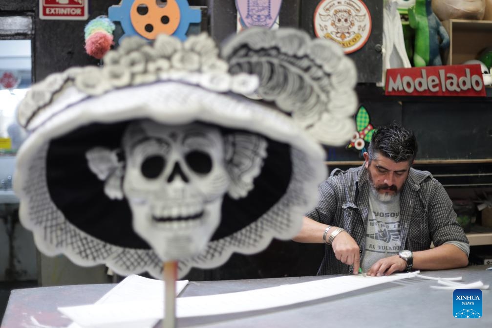 Decorations are prepared before the 2024 Day of the Dead Parade at a workshop in Mexico City, Mexico, Oct. 23, 2024. Day of the Dead is a Mexican holiday involving family and friends gathering to pray for and remember friends and family members who have died. (Photo: Xinhua)