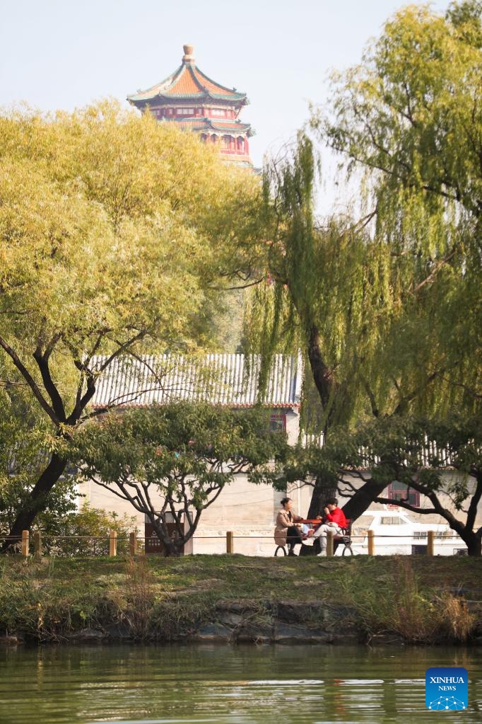 Tourists enjoy the autumn scenery at the Summer Palace in Beijing, capital of China, on Oct. 24, 2024. The Summer Palace is China's largest imperial park and among the most noted classical gardens in the world. In 1998, it was listed as one of the World Heritage Sites by UNESCO. (Photo: Xinhua)