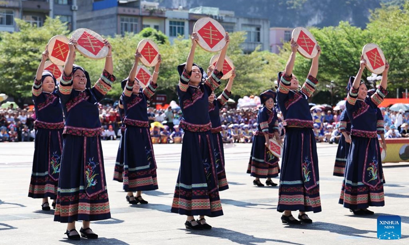 Actors perform at an event celebrating harvest in Tiandeng County, south China's Guangxi Zhuang Autonomous Region, Oct. 23, 2024. Many places in Guangxi ushered in the harvest season of late rice. (Photo: Xinhua)