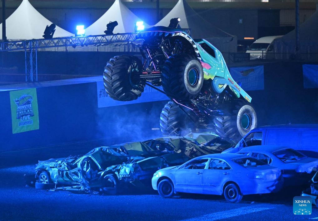 A Hot Wheels Monster Truck performs during a show in Mubarak Al-Kabeer Governorate, Kuwait, Oct. 23, 2024. The show named Hot Wheels Monster Trucks Live Glow Party kicked off on Wednesday at Kuwait's Mubarak Al-Kabeer Governorate, and will last from Oct. 23 to 26 for four different performances. (Photo: Xinhua)