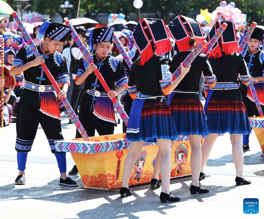 Actors perform at an event celebrating harvest in Tiandeng County, south China's Guangxi Zhuang Autonomous Region, Oct. 23, 2024. Many places in Guangxi ushered in the harvest season of late rice. (Photo: Xinhua)