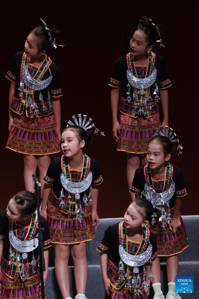 A children's chorus from Wuzhishan City performs during a Sino-French children's chorus festival held at Hainan Song and Dance Theater in Haikou, south China's Hainan Province, Oct. 25, 2024. (Photo: Xinhua)