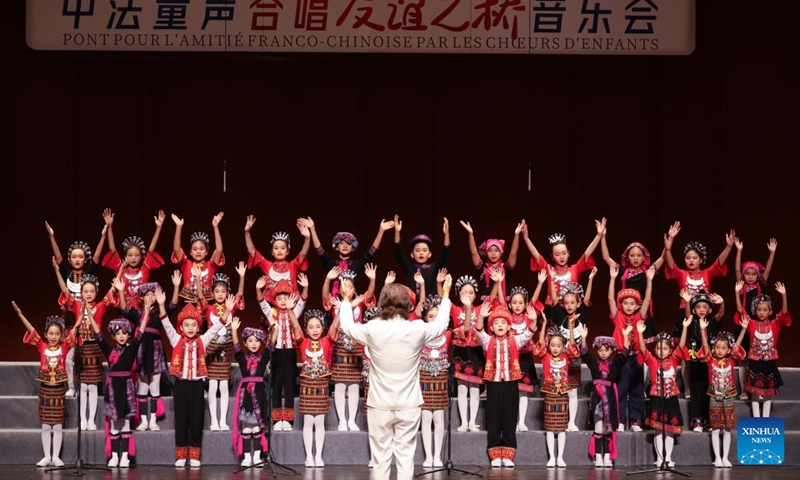 A children's chorus from Wuzhishan City performs during a Sino-French children's chorus festival held at Hainan Song and Dance Theater in Haikou, south China's Hainan Province, Oct. 25, 2024. (Photo: Xinhua)