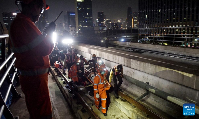 Rescuers participate in an emergency drill for passengers along the Light Rail Transit (LRT) Jabodebek (Jakarta-Bogor-Depok-Bekasi) in Jakarta, Indonesia, Oct. 26, 2024.(Photo: Xinhua)