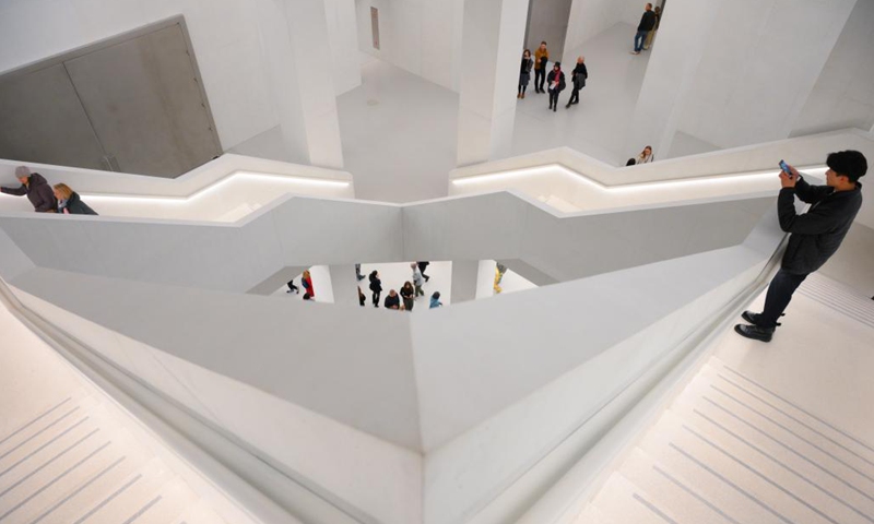 People visit the new building of the Museum of Modern Art in Warsaw, Poland on Oct. 25, 2024.

The new building of Warsaw's Museum of Modern Art officially opened to public on Friday. The building features a monochromatic cubic design, reflecting a minimalist style.(Photo: Xinhua)