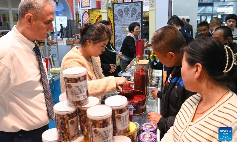 People visit an exhibition booth of Iranian saffron at the 31st China Yangling Agricultural Hi-tech Fair in Yangling, northwest China's Shaanxi Province, Oct. 25, 2024. Featuring innovations in agricultural high-tech achievements, the 31st China Yangling Agricultural Hi-tech Fair kicked off here on Friday. The fair will last until Oct. 29. (Photo: Xinhua)