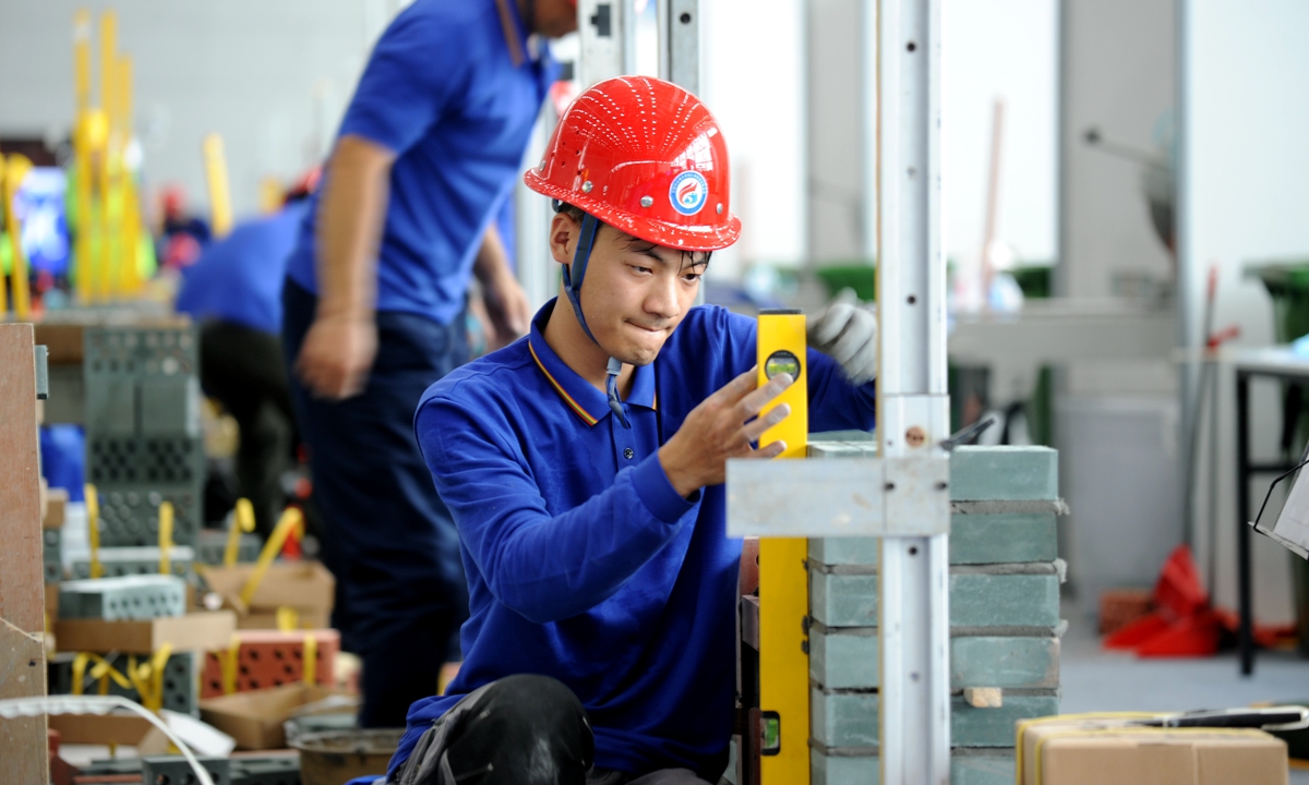 Competitors participate in a masonry project competition in Hefei, East China's Anhui Province, on October 27, 2024. The finals of the 2024 National Industry Vocational Skills Competition feature 401 contestants from 32 delegations representing provinces, regions and municipalities across the country. Photo: VCG