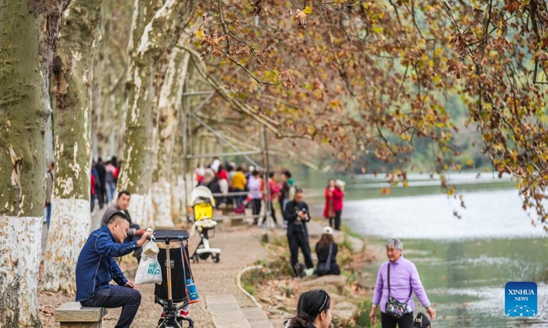 People enjoy themselves at Huaxi National Urban Wetland Park in Guiyang, capital of southwest China's Guizhou Province, Oct. 27, 2024. (Photo: Xinhua)