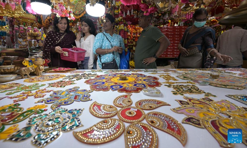 People shop for decorative items at the temporary Deepavali market, on the last weekend ahead of Deepavali, at Singapore's Little India, on Oct. 27, 2024. The Hindu festival Deepavali falls on Oct. 31 this year. (Photo: Xinhua)