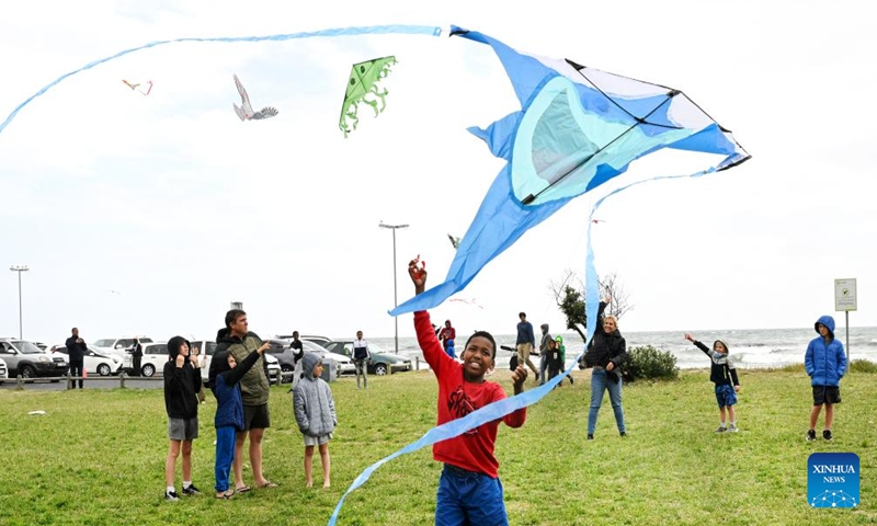 People fly kites at the Cape Town International Kite Festival in Cape Town, South Africa, on Oct. 27, 2024. The annual event was held here on Sunday, coloring the sky with vibrant kites. (Photo: Xinhua)