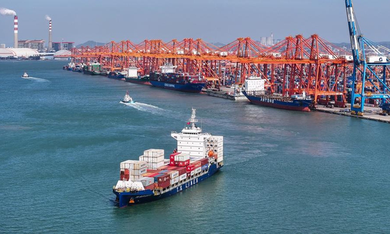 An aerial drone photo taken on Oct. 24, 2024 shows a container ship carrying new energy vehicle (NEV) parts at the Qinzhou Port in Qinzhou, south China's Guangxi Zhuang Autonomous Region. (Photo: Xinhua)