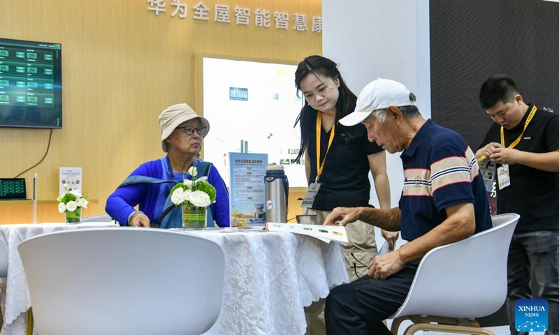 Senior citizens learn about new products displayed at the 2024 Shenzhen International Intelligent Elderly Care Industry Expo in Shenzhen, south China's Guangdong Province, Oct. 27, 2024. A total of 203 exhibitors from home and abroad have brought more than 1,000 products and technologies for elderly care to the expo, which was held from Oct. 25 to 27 in Shenzhen. (Photo: Xinhua)