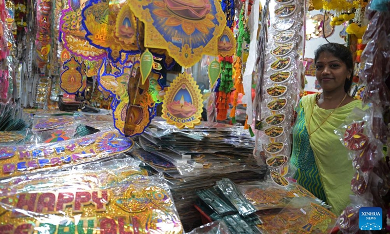 A stall owner is seen at the temporary Deepavali market, on the last weekend ahead of Deepavali, at Singapore's Little India, on Oct. 27, 2024. The Hindu festival Deepavali falls on Oct. 31 this year. (Photo: Xinhua)