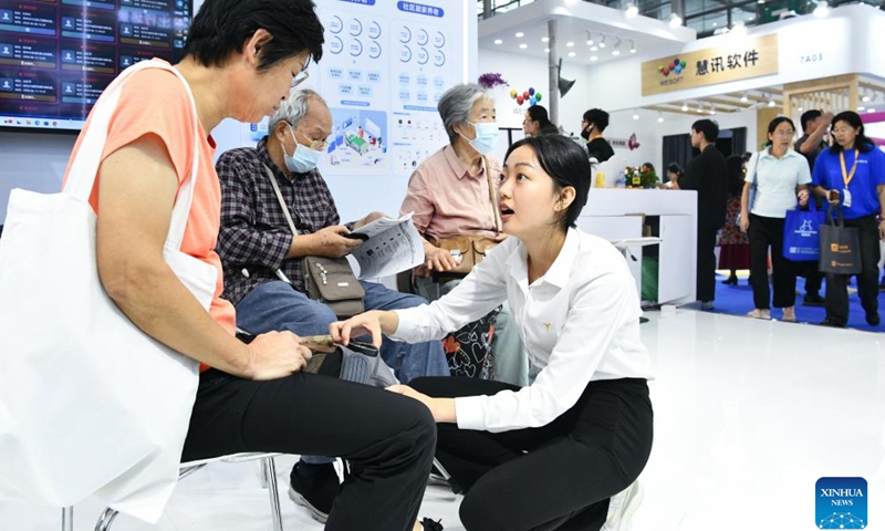 Senior citizens try new products displayed at the 2024 Shenzhen International Intelligent Elderly Care Industry Expo in Shenzhen, south China's Guangdong Province, Oct. 27, 2024. A total of 203 exhibitors from home and abroad have brought more than 1,000 products and technologies for elderly care to the expo, which was held from Oct. 25 to 27 in Shenzhen. (Photo: Xinhua)