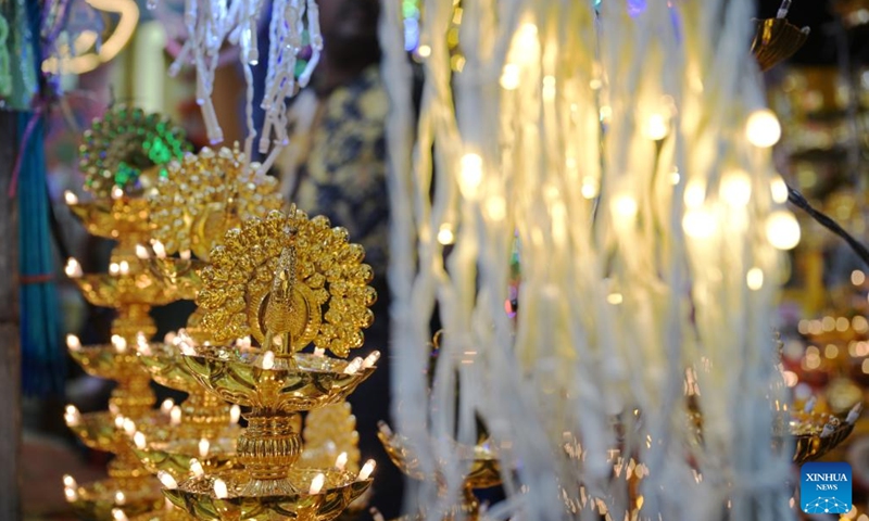 Peacock-themed decorative lamps are seen on sale at the temporary Deepavali market, on the last weekend ahead of Deepavali, at Singapore's Little India, on Oct. 27, 2024. The Hindu festival Deepavali falls on Oct. 31 this year. (Photo: Xinhua)