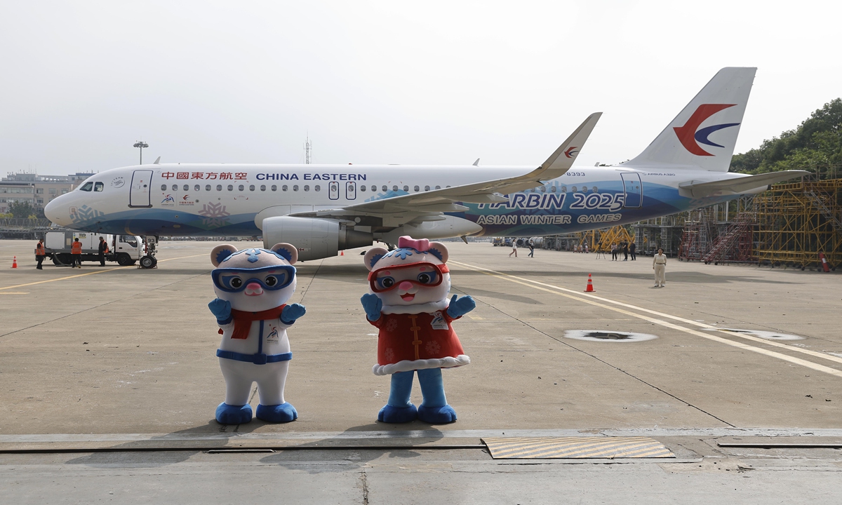 The mascots for the Asian Winter Games officially unveil the first plane sporting the Games logo in Shanghai on October 28, 2024 on the occasion of the 100-day countdown to the 9th Asian Winter Games Harbin 2025.  Photo: VCG