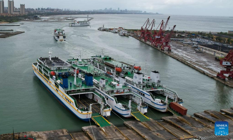 This aerial drone photo taken on Oct. 27, 2024 shows ships leaving Xiuying Port in Haikou, south China's Hainan Province. The Xinhai Port, Xiuying Port and a railway port in Haikou resumed operation on Sunday afternoon as the impact of Typhoon Trami, this year's 20th typhoon, weakened. (Photo: Xinhua)