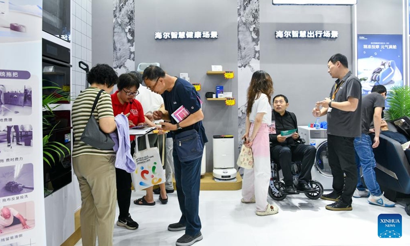 Senior citizens visit the 2024 Shenzhen International Intelligent Elderly Care Industry Expo in Shenzhen, south China's Guangdong Province, Oct. 27, 2024. A total of 203 exhibitors from home and abroad have brought more than 1,000 products and technologies for elderly care to the expo, which was held from Oct. 25 to 27 in Shenzhen. (Photo: Xinhua)