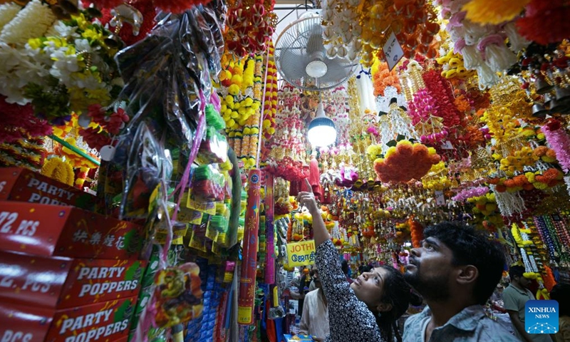 People shop for decorative items at the temporary Deepavali market, on the last weekend ahead of Deepavali, at Singapore's Little India, on Oct. 27, 2024. The Hindu festival Deepavali falls on Oct. 31 this year. (Photo: Xinhua)