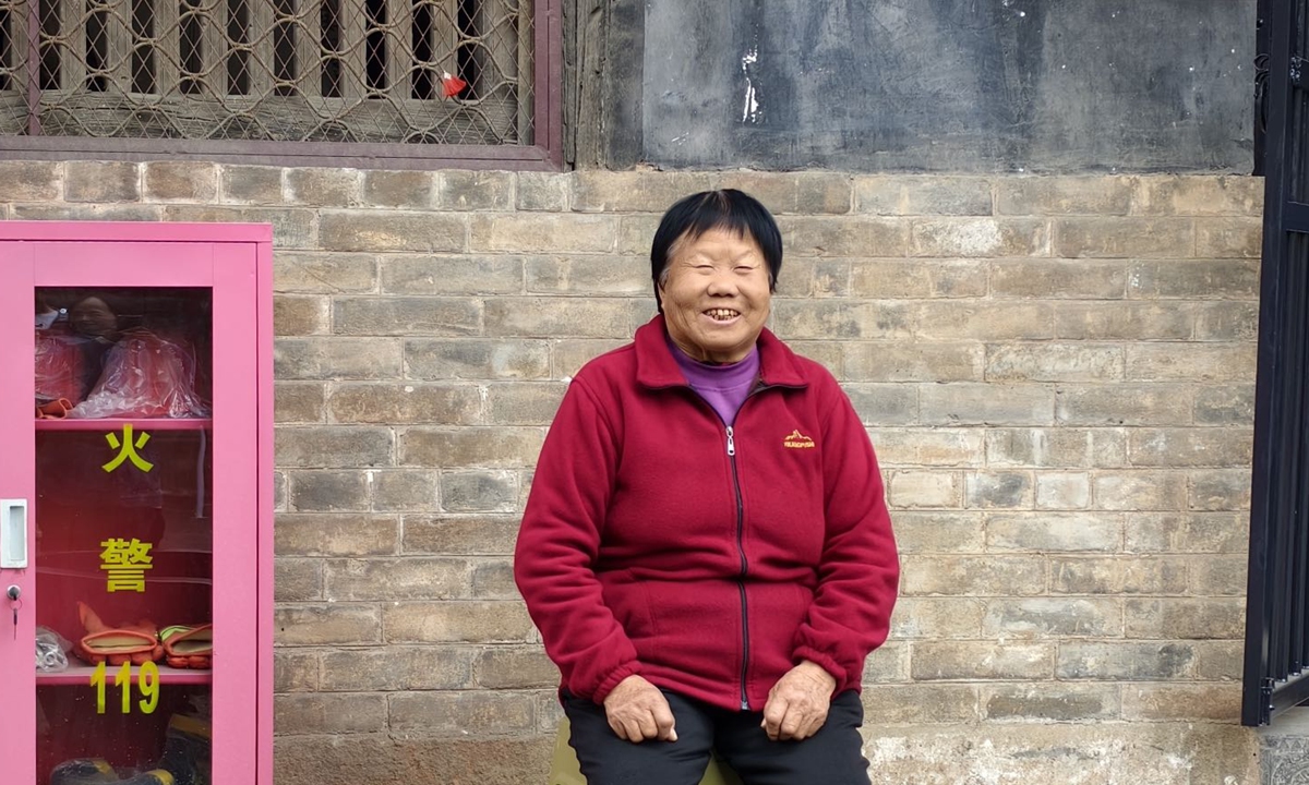 Retired temple caretaker Wang Gaiying sits peacefully at Tiefo Temple on October 30, 2024. Photo: Courtesy of Zhang Jiaqi 