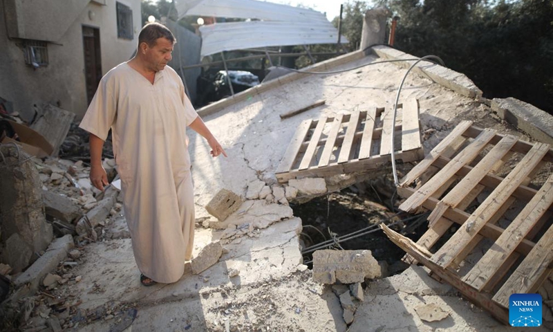 A man checks the damage after an Israeli attack in al-Nuseirat refugee camp, central Gaza Strip, on Oct. 28, 2024. The Palestinian death toll from ongoing Israeli attacks on the Gaza Strip has surpassed 43,000, Gaza-based health authorities said in a statement on Monday. (Photo: Xinhua)