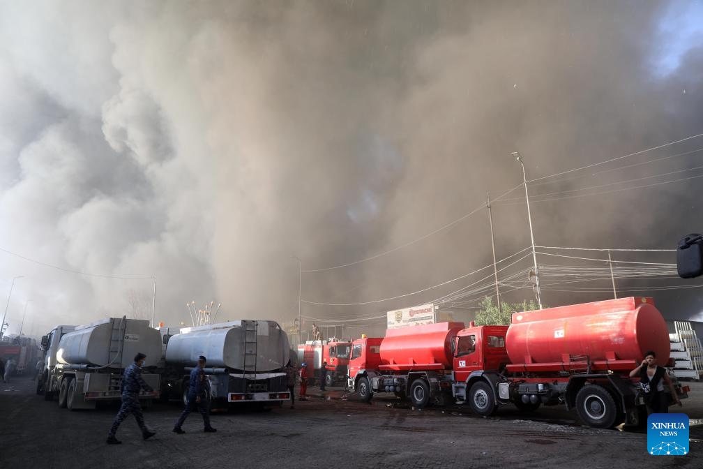 Firefighters work at a fire site near a warehouse in Baghdad, Iraq on Oct. 27, 2024. A fire broke out at a warehouse in Iraqi capital Baghdad on Sunday. (Photo: Xinhua)