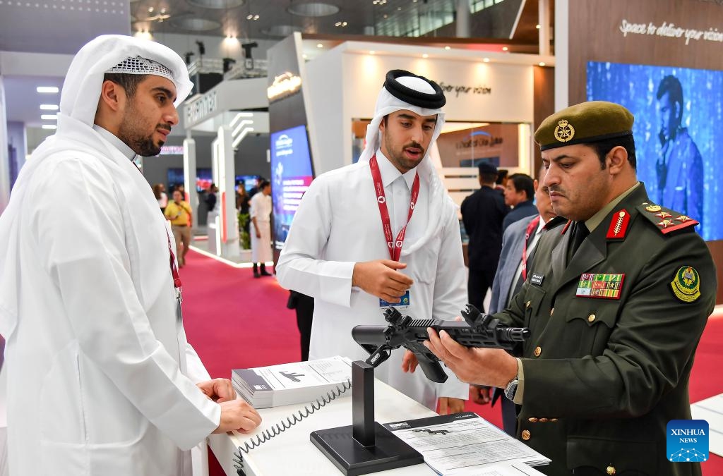 Visitors look at a gun at Milipol Qatar 2024, an international event for homeland security and civil defense, at Doha Exhibition and Convention Center in Doha, Qatar, on Oct. 29, 2024. The three-day exhibition attracted more than 250 exhibitors. (Photo: Xinhua)