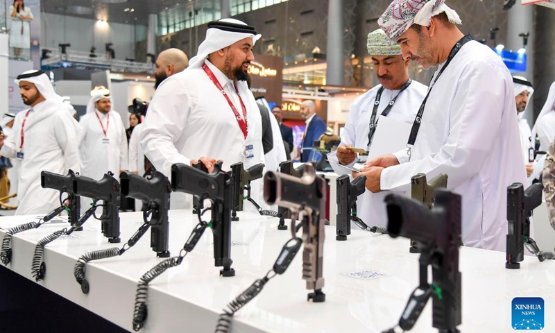 Visitors look at guns on display at Milipol Qatar 2024, an international event for homeland security and civil defense, at Doha Exhibition and Convention Center in Doha, Qatar, on Oct. 29, 2024. The three-day exhibition attracted more than 250 exhibitors. (Photo: Xinhua)