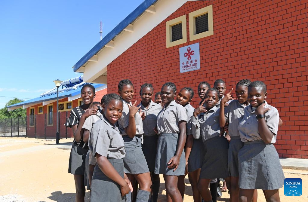 Students pose for a group photo in front of Satotwa Primary School in the Kavango West region in Namibia, Oct. 28, 2024. The Namibian government on Monday accepted the handover of four China-aided schools in the Kavango West and Zambezi regions of the southern African country. (Photo: Xinhua)