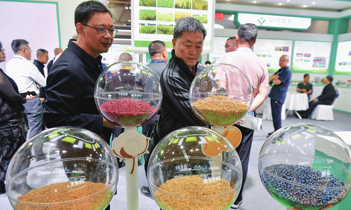 Visitors view seeds on display at an international seed expo that opened in Fuzhou, East China's Fujian Province on October 30, 2024. This event has an indoor exhibition area of 20,000 square meters, showcasing new products, new equipment, new technologies and new achievements in China's seed sector. Photo: VCG