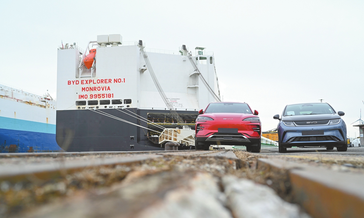 Two new EVs of the Chinese car manufacturer BYD stand in front of the car freighter BYD Explorer No.1 in Bremen, Germany on February 26, 2024. Photo: CFP