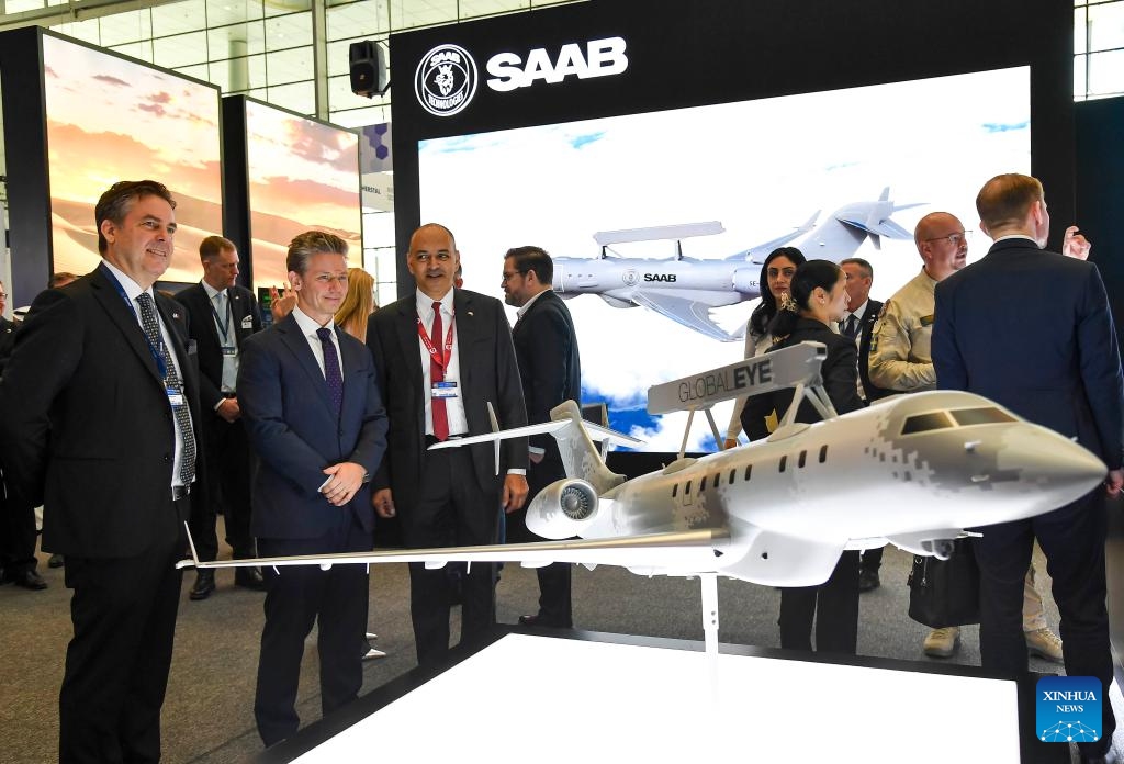 Visitors look at a model of the Global Eye plane at Milipol Qatar 2024, an international event for homeland security and civil defense, at Doha Exhibition and Convention Center in Doha, Qatar, on Oct. 29, 2024. The three-day exhibition attracted more than 250 exhibitors. (Photo: Xinhua)