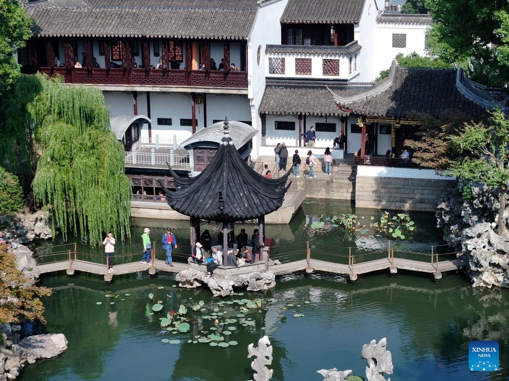 A drone photo taken on Oct. 23, 2024 shows people visiting Lion Grove Garden in Suzhou, east China's Jiangsu Province. About a 20-minute ride by high-speed train from east China's Shanghai, Suzhou is one of the richest cities in China, with its more than 100 classical gardens considered some of the most beautiful in the country, and nine of them serving as UNESCO world heritage sites. (Photo: Xinhua)