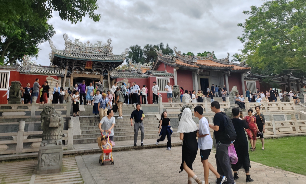 Visitors explore near the entrance of the Dongshan Guandi Temple in Dongshan county, East China's Fujian Province, on October 2, 2024. Photo by Zhang Congyuan