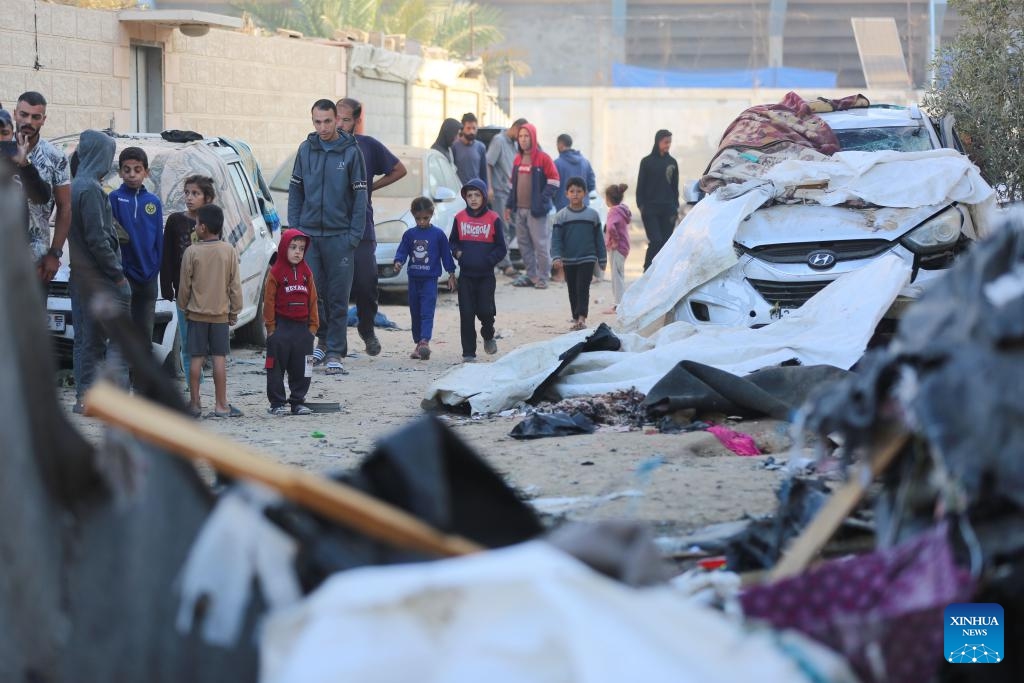 Palestinians check a destroyed tent after Israeli bombardment in the city of Deir al-Balah in central Gaza Strip, on Oct. 30, 2024. (Photo: Xinhua)