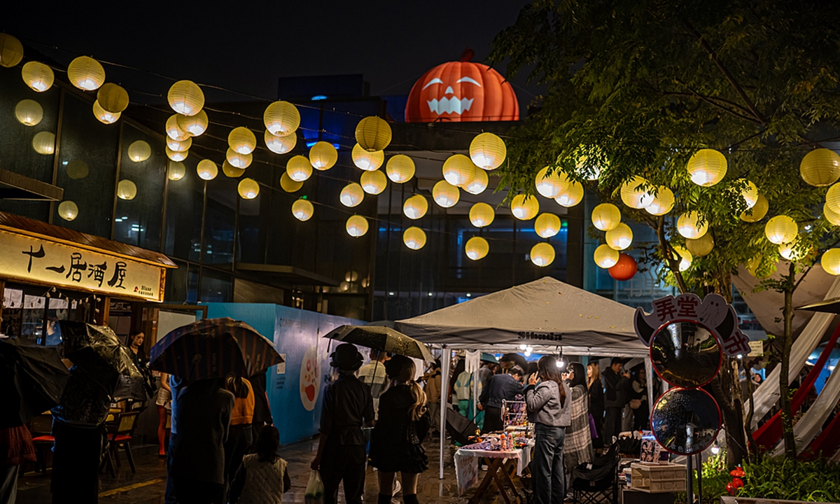 People explore in a night market decorated with Halloween elements in Shaoxing, East China's Zhejiang Province, on October 31, 2024. Photo: VCG 