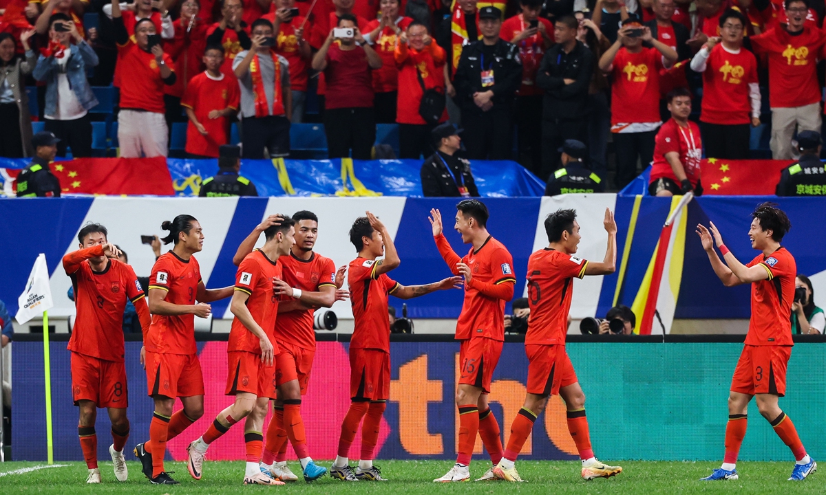 Chinese players celebrate scoring in the World Cup Asian qualifying match against Indonesia on October 15, 2024 in Qingdao, East China's Shandong Province. Photo: VCG