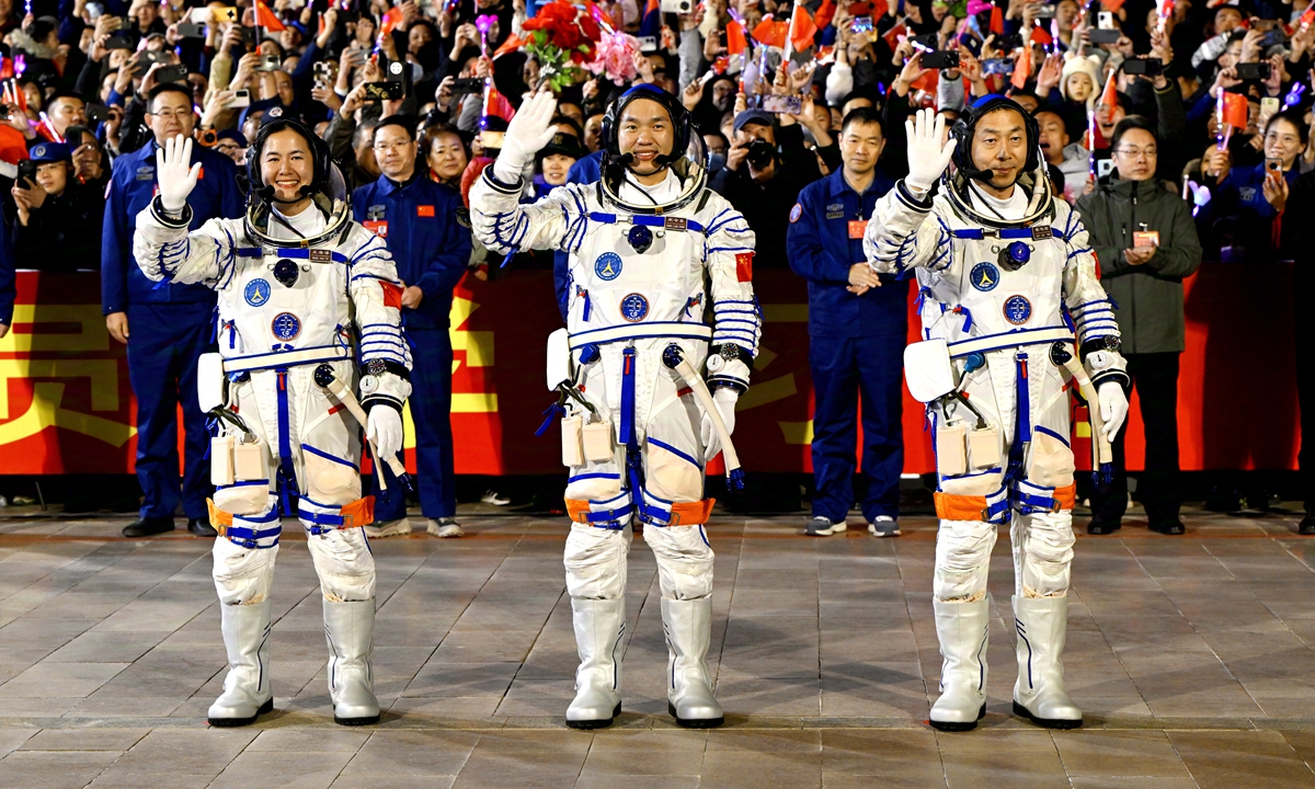 The Shenzhou-19 manned spacecraft crew Wang Haoze, Song Lingdong and Cai Xuzhe (from left to right) wave hands to the public at the see-off ceremony at the Jiuquan Satellite Launch Center on October 30, 2024. Photo: VCG