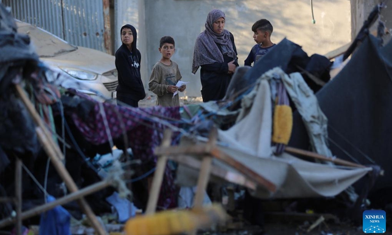 Palestinians check a destroyed tent after Israeli bombardment in the city of Deir al-Balah in central Gaza Strip, on Oct. 30, 2024. (Photo: Xinhua)