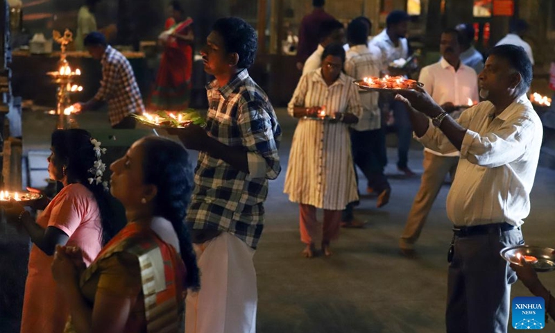 Hindu devotees hold oil lamps to celebrate Diwali, the Hindu festival of lights, at a Hindu temple in Colombo, Sri Lanka on Oct. 31, 2024. (Photo: Xinhua)