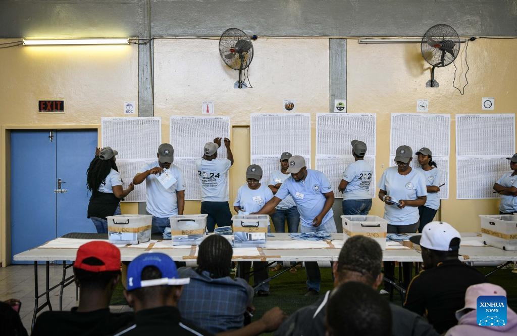 Staff members count ballots at a polling station in Tlokweng, South-East district, Botswana, Oct. 31, 2024. Botswana nationals on Wednesday headed to polling stations to cast their ballots for new parliamentarians and local authorities. According to the southern African country's electoral law, the polling will determine 61 members of the National Assembly and 609 local councilors, with the party that holds at least 31 parliament seats to be declared as the winner. (Photo: Xinhua)