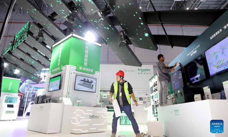 Workers set up exhibition booths for the upcoming 7th China International Import Expo (CIIE) at the National Exhibition and Convention Center (Shanghai), the main venue for the CIIE, in east China's Shanghai, Nov. 2, 2024. Preparations for the 7th CIIE, which is scheduled to take place in Shanghai from Nov. 5 to 10, have entered the final stage. (Photo: Xinhua)