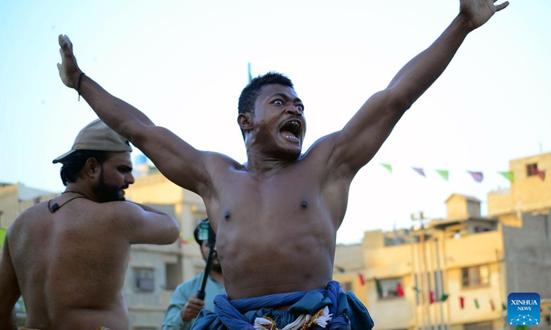 A wrestler celebrates after a traditional wrestling competition in southern Pakistani port city of Karachi on Nov. 1, 2024. (Photo: Xinhua)