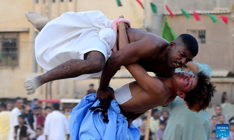 Wrestlers compete in a traditional wrestling match in southern Pakistani port city of Karachi on Nov. 1, 2024.  (Photo: Xinhua)