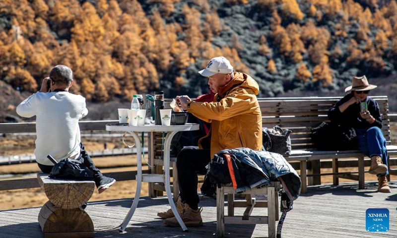 Tourists take a rest at a service station of Yading scenic spot in Daocheng County of Tibetan Autonomous Prefecture of Garze, southwest China's Sichuan Province, Oct. 31, 2024. (Photo: Xinhua)