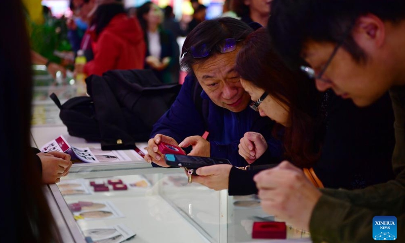 Visitors purchase foreign commemorative coins during the Beijing International Coin Exposition 2024 at the China National Convention Center in Beijing, capital of China, Nov. 1, 2024. (Photo: Xinhua)