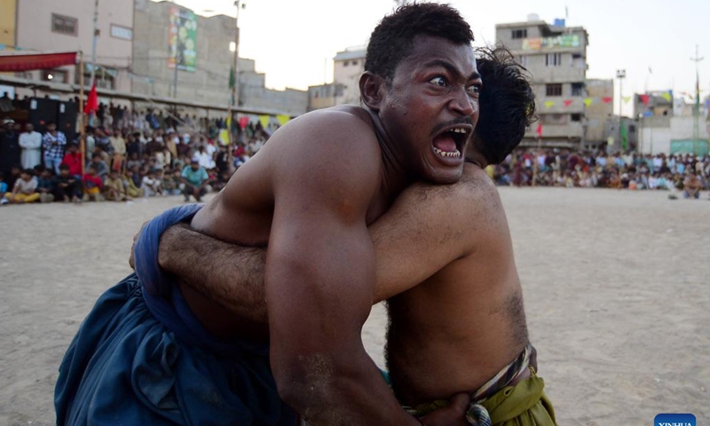 Wrestlers compete in a traditional wrestling match in southern Pakistani port city of Karachi on Nov. 1, 2024. (Photo: Xinhua)